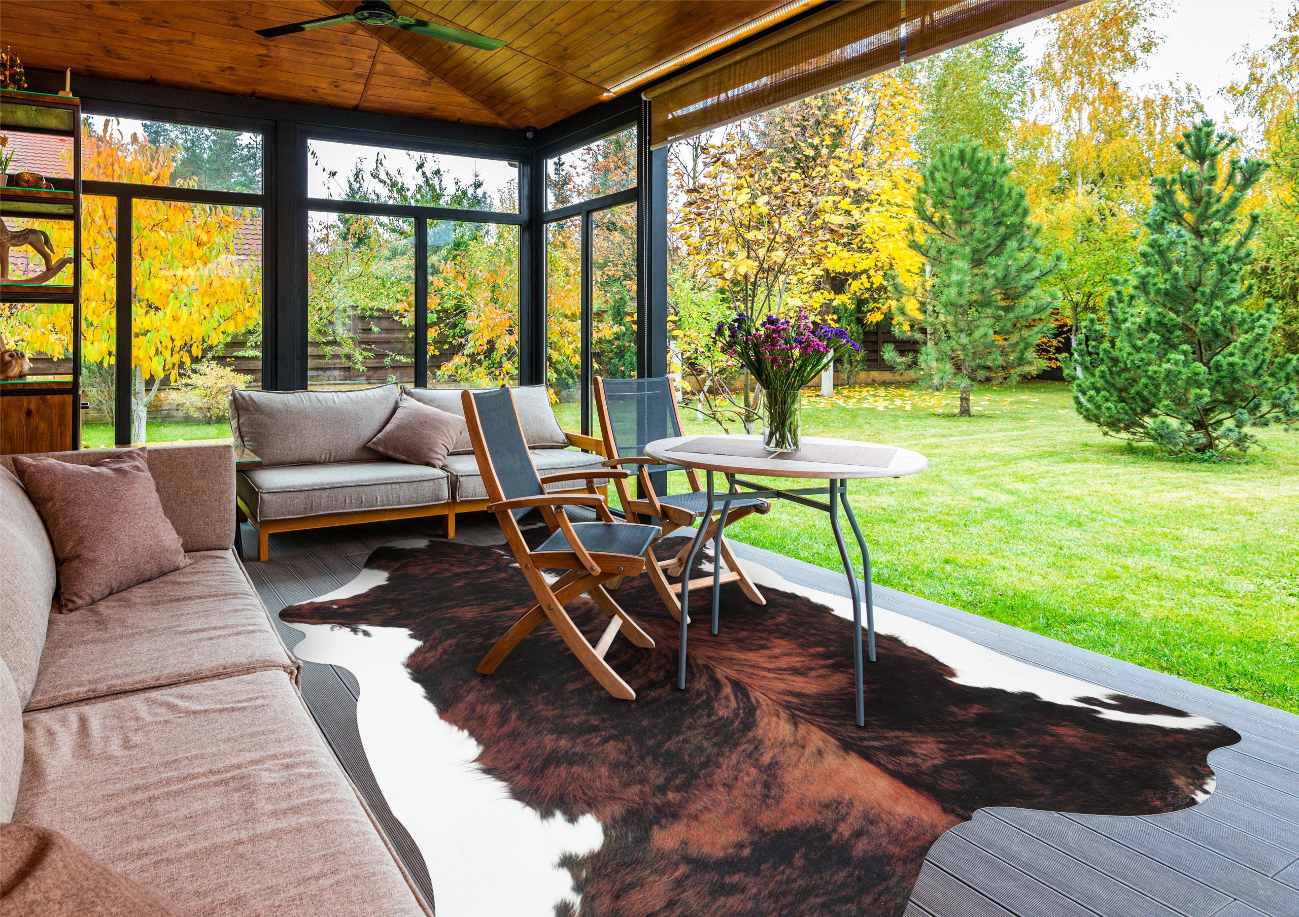 Faux cowhide rug adding texture to an outdoor patio