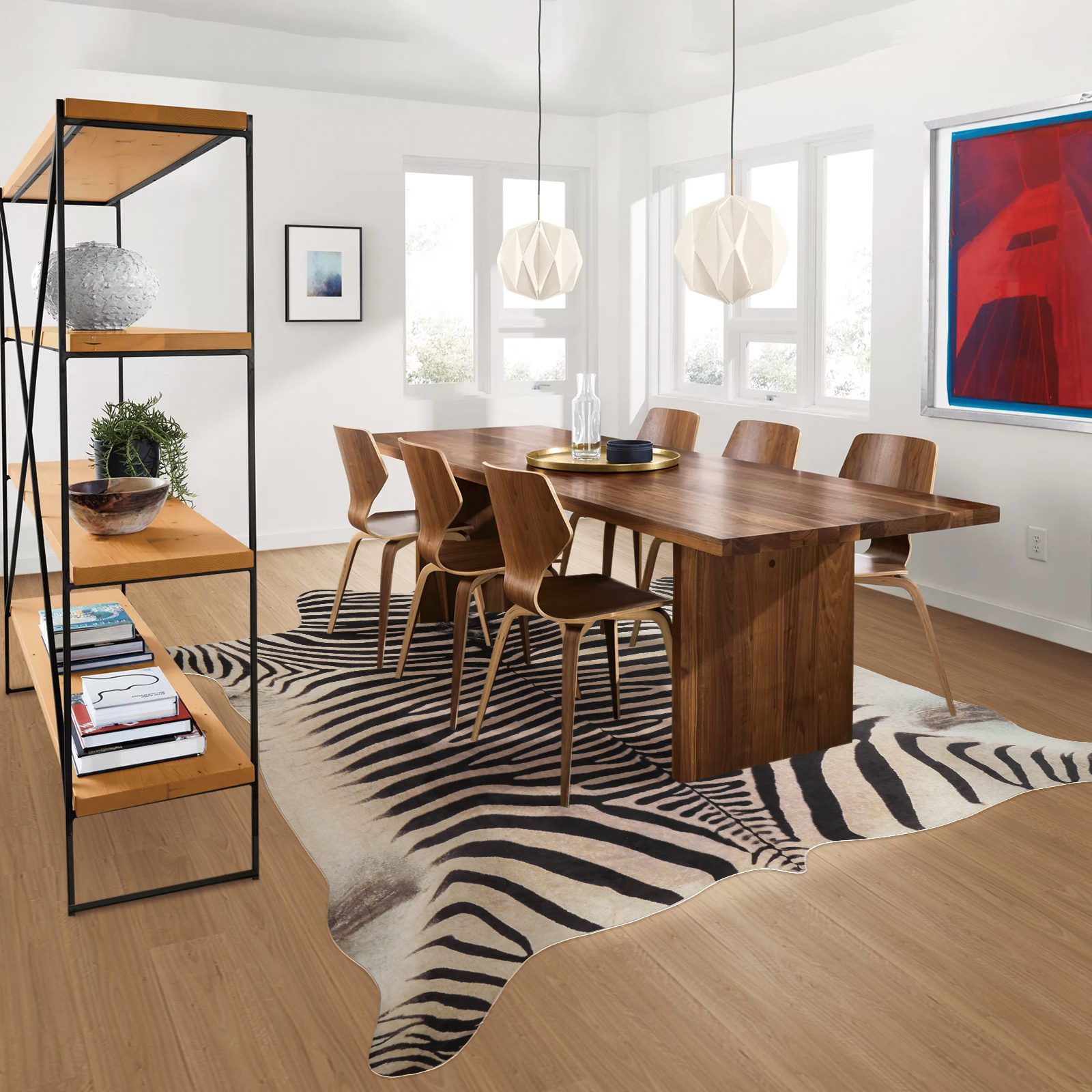 Open-plan dining room featuring faux cowhide rug under dining set