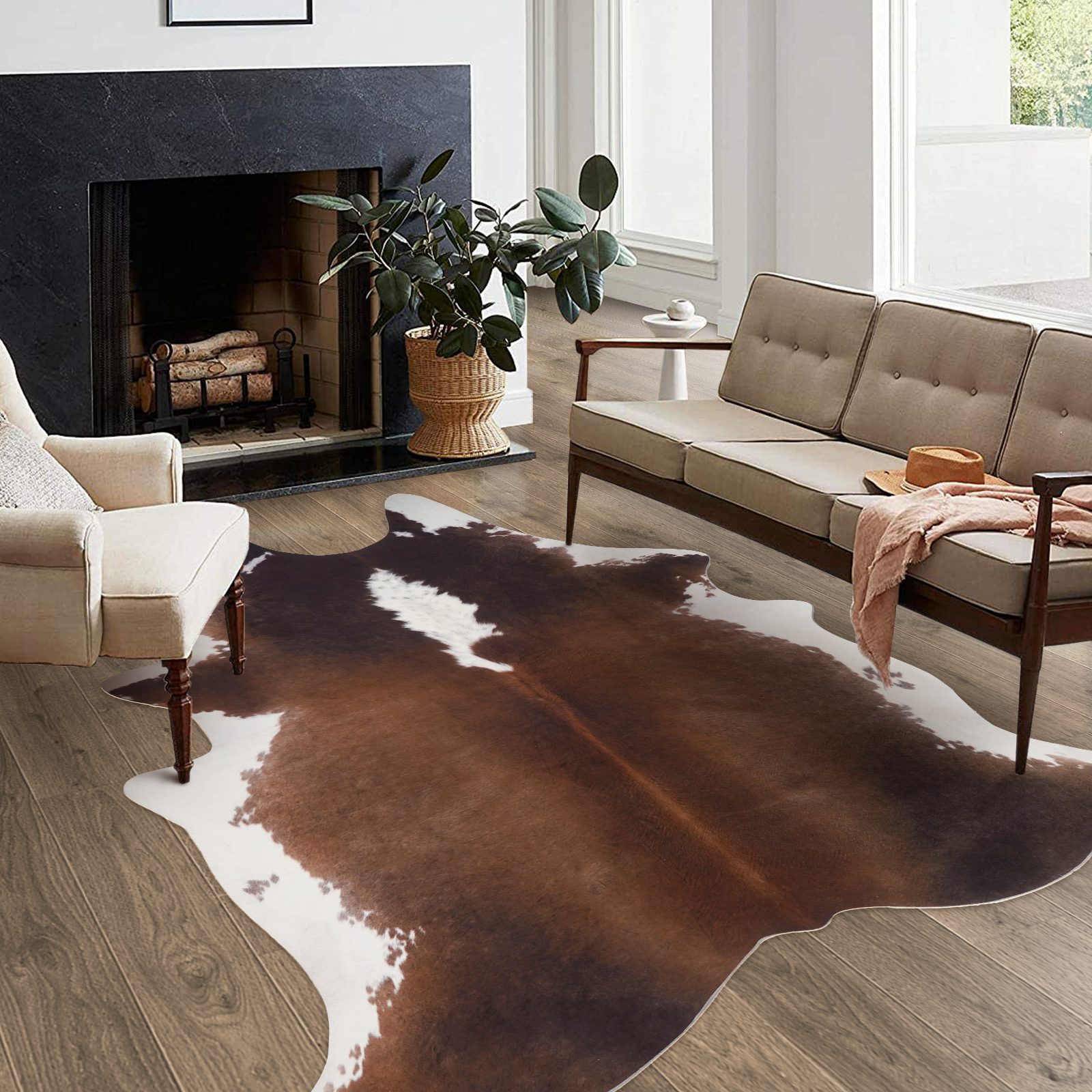 Faux cowhide rug placed under a mid-century modern coffee table in a living room