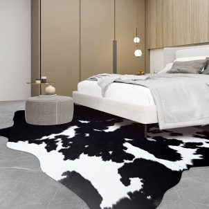Black and white cow print faux leather rug