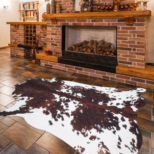 Brown and white dotted faux cowhide rug