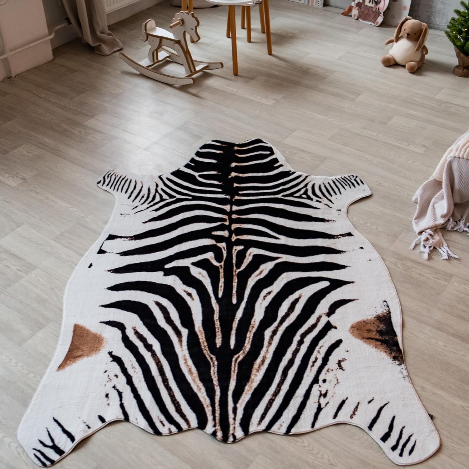 Black and white zebra pattern faux cowhide rug with fur